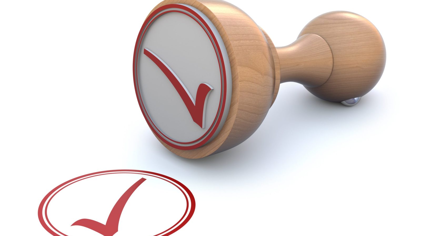 Wooden stamp with red checkmark symbol